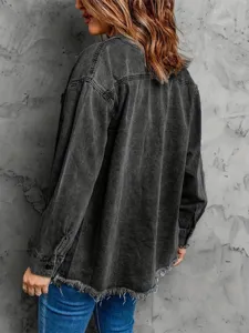 Stylish women's washed black oversized denim jacket with frayed hem and long sleeves.