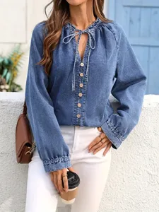 Plus size women casual washed blue denim top V-neck long sleeve button shirt detail.
