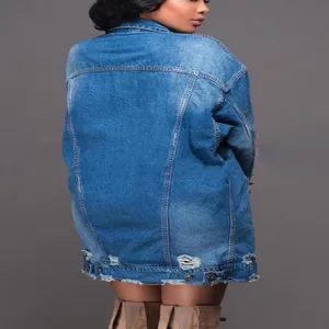 Oversized long sleeve denim jacket back view with distressed hem and washed blue denim.