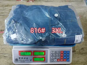 Detail view of the packaged blue denim jacket showing size and packaging quality.