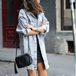 Oversized light blue denim jacket streetwear style, long sleeve casual outerwear detail view.