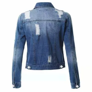 Back view of women's blue distressed denim jacket, featuring long sleeves and raw hem.