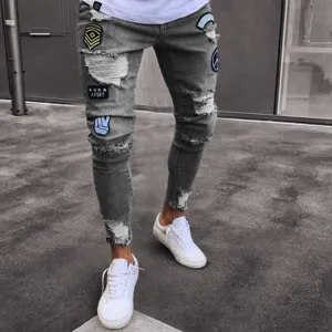 Men's slim fit distressed grey skinny jeans with cool embroidered patches and ripped design.