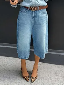 High-waisted cropped denim capri jeans detail view, showcasing tailored waist and hem.