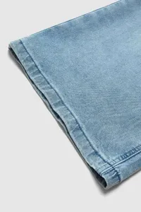 Light blue denim jeans hem detail, casual cropped pants fabric texture close up view