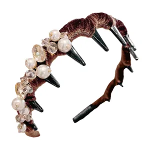 Handmade beaded rhinestone headband with pearl and spike design for women. Main view product shot.