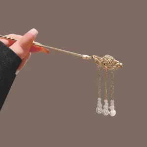 Golden Chinese vintage hairpin with pearl tassels, elegant metal hair stick for women styling.