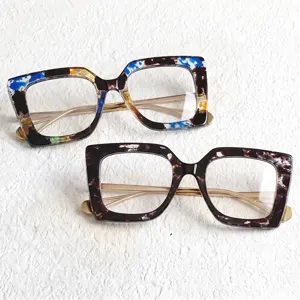 Trendy large square frame glasses with chic tortoiseshell pattern and sleek gold metal temples.