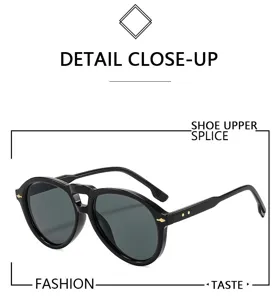 Black double bridge aviator sunglasses detail view, vintage fashion sun protection eyewear.