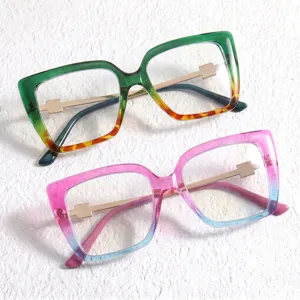Detailed view of trendy gradient square eyeglasses with stylish colorblocked frames and metal accents.