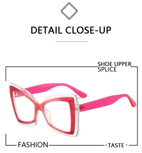 Close up detail of fashionable glitter cat eye reading glasses with colorful butterfly frame.