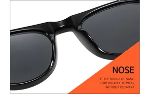 Close-up detail shot of black sunglasses showing the ergonomic nose bridge and comfortable frame.