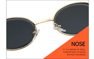 Close-up detail of gold metal small oval sunglasses bridge and comfortable transparent nose pads.