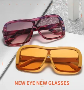 Detailed view of trendy oversized one-piece square sunglasses, stylish eyewear for men and women.