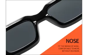 Gros plan sur le pont de lunettes de soleil noires élégantes à monture épaisse et pont confortable.