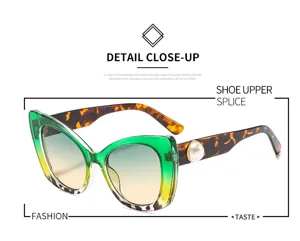 Modieuze dames zonnebril kattenoog groen verloop schildpadpootjes parel detail chic