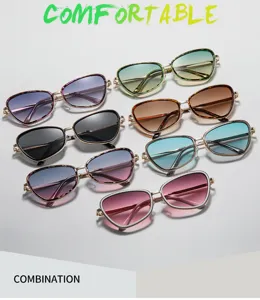 Modische Sonnenbrille mit Metallrahmen und Cat-Eye-Gläsern in bunten Farbverläufen