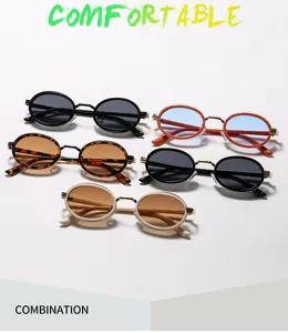 Lunettes de soleil ovales rétro avec monture métallique style steampunk pour look tendance.