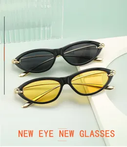 Detailaufnahme trendiger Cat-Eye-Sonnenbrille mit Metallakzenten in Schwarz und Gelb.
