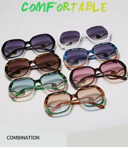 Lunettes de soleil cat-eye oversize élégantes pour femmes avec verres dégradés tendance.