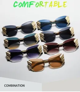 Trendy rimless gradient sunglasses with stylish gold winged side details for daily wear.