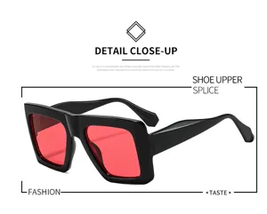 Trendy square sunglasses with bold black frames and striking red lenses for fashion look.