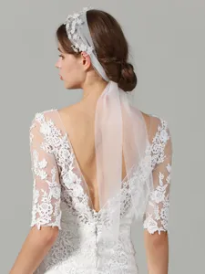 Detailed view of the elegant bridal floral pearl headband veil, perfect for wedding dress styling.