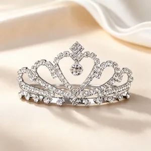 Children rhinestone tiara comb detail view, sparkling crystal crown hair accessory for party.