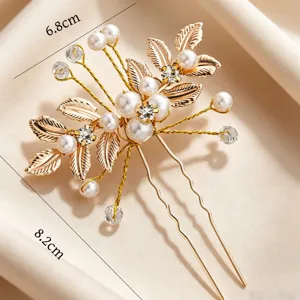 Fourche à cheveux en U dorée avec perles et strass, élégant accessoire de mariée.