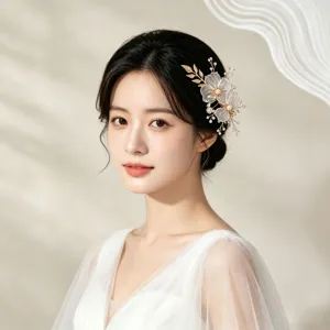 Exquisite Korean style bridal hair clip with gold hollow petals and faux pearls for elegant updos.