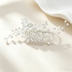 Exquisite bridal hair comb detail featuring faux pearls and sparkling crystals for elegant styling.