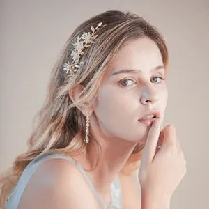 Bridal gold alloy leaf hair vine and earrings detail, elegant wedding hair accessories for brides.