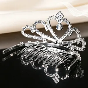 Children rhinestone crown hair comb detail view, sparkling silver metal tiara accessory.
