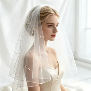 Elegant bridal veil with faux pearls, perfect for wedding photography and bridal events.