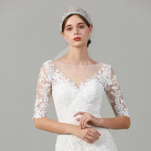 Bridal lace wedding dress veil detail, elegant french style handmade fabric headband accessory.