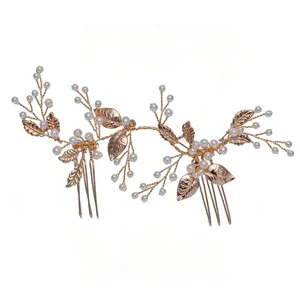 Handmade bridal hair comb with gold leaves and faux pearls, perfect wedding hair accessory.