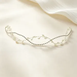 Handmade bridal hair vine with pearls and rhinestones, elegant wedding accessory for women detail.