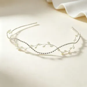 Detailed close-up of handmade bridal hair vine featuring artificial pearls and rhinestones.