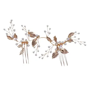 Handmade bridal hair comb with faux pearls and alloy leaves, ideal for weddings and parties.