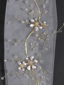 Handmade bridal hair vine with sparkling crystals and pearls on sheer tulle fabric accessory