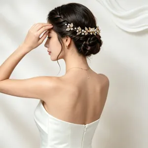 Elegant bridal pearl and gold leaf hair vine detail, perfect for wedding and party styling.