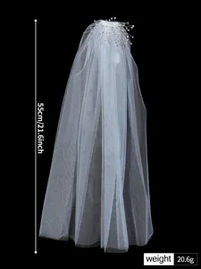 Elegant white bridal veil with sparkling rhinestones, perfect for wedding dress accessories.