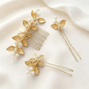 Gold bridal hair comb and pin detail, handcrafted pearl leaf design for wedding and evening party.