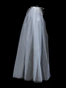 Close-up view of the sparkling rhinestone bridal veil detail, delicate craftsmanship.