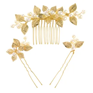 Gold bridal hair comb and pins set with faux pearls and leaves for wedding party styling.