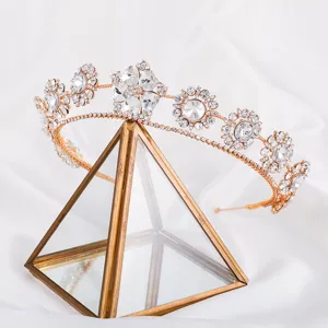 Exquisite rhinestone crystal floral tiara detail shot on a geometric display stand.