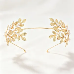 Elegant gold bridal leaf headband with pearls, perfect for wedding party hair accessories.