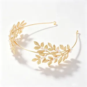 Gold bridal headband with leaf and faux pearl designs, elegant wedding hair accessory for women.