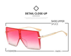 Lunettes de soleil carrées oversize avec verres dégradés rouges et branches en métal.