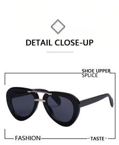 Klassische Piloten-Sonnenbrille mit markantem schwarzem Acetat-Rahmen und Metall-Doppelsteg.